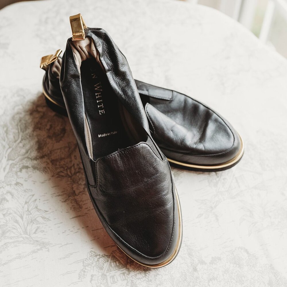J.W. White Black Leather Slip-On Loafers with Gold Accent